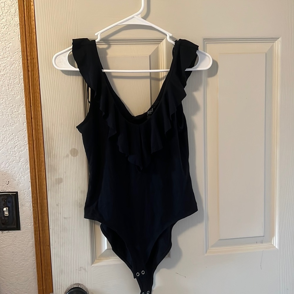 Ruffled body suit.